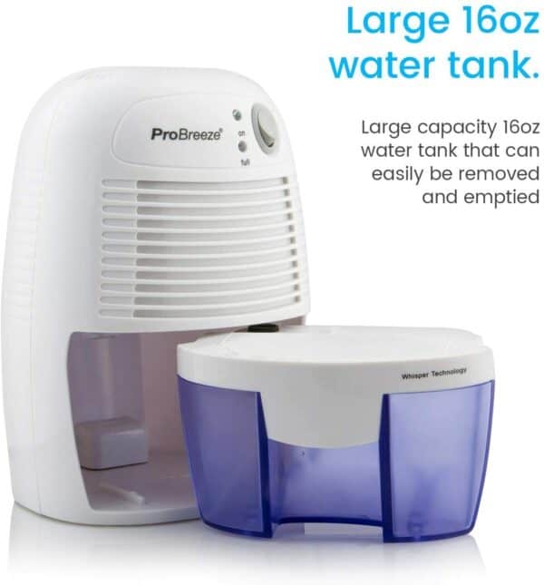 A dehumidifier with a water tank next to it.