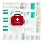 A first aid kit with various items on a white background.