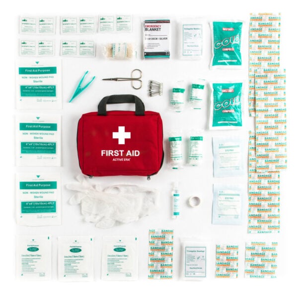 A first aid kit with various items on a white background.