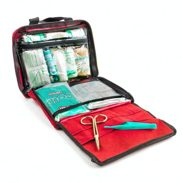 An emergency first aid kit with scissors and bandages.