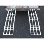 A pair of aluminum ramps on the back of a truck.