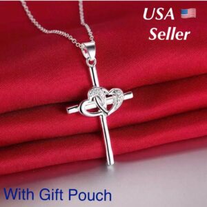 A silver cross necklace with a gift pouch.
