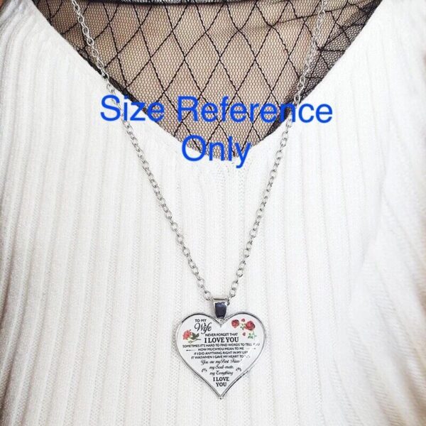 A necklace with a heart shaped pendant that says size reference only.