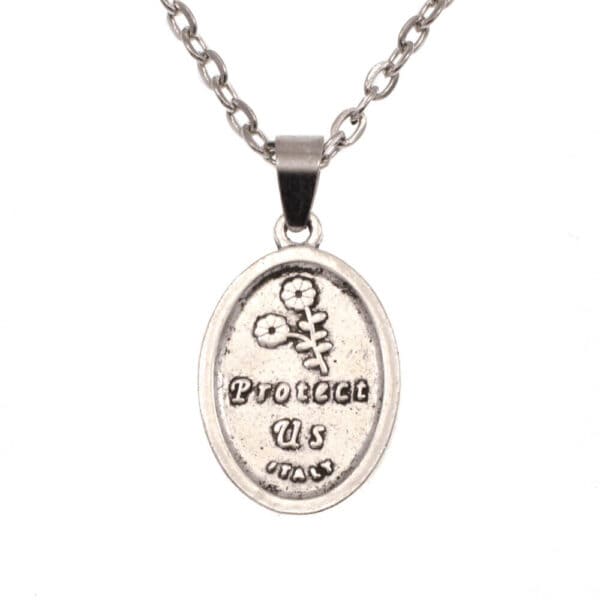 A silver pendant with the words'prove it to me'on it.
