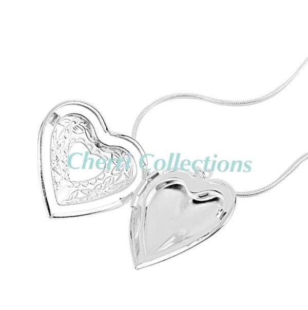 A heart shaped locket in sterling silver.