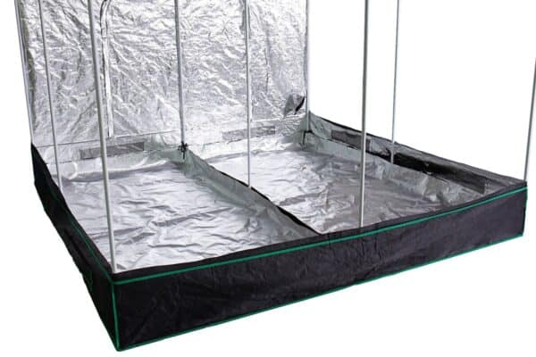 A grow tent with a black and silver cover.