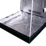 A grow tent with a sheet of aluminum foil.