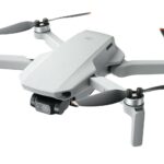 A dji mavic drone with propellers on a white background.