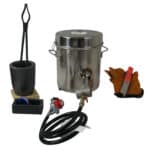 A metal pot with a hose and other items.