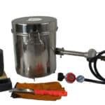 A set of tools and a metal pot with a lid.