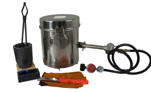 A set of tools and a metal pot with a lid.