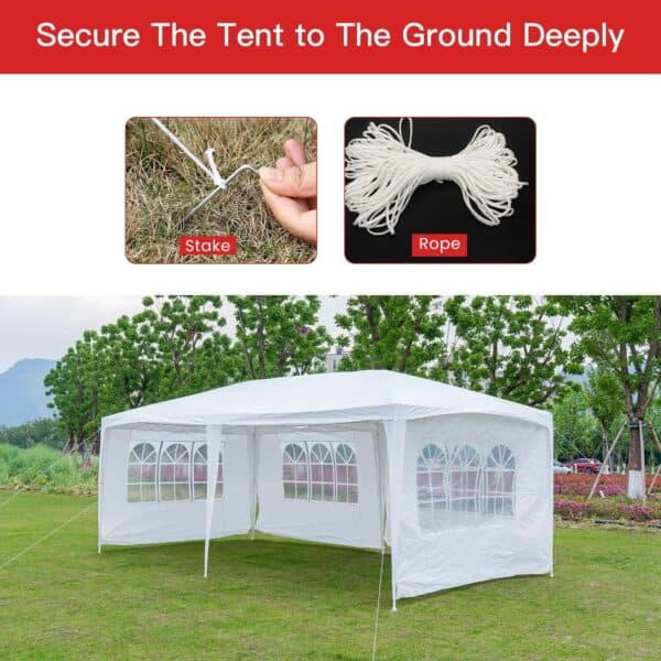 A white tent in a grassy area.