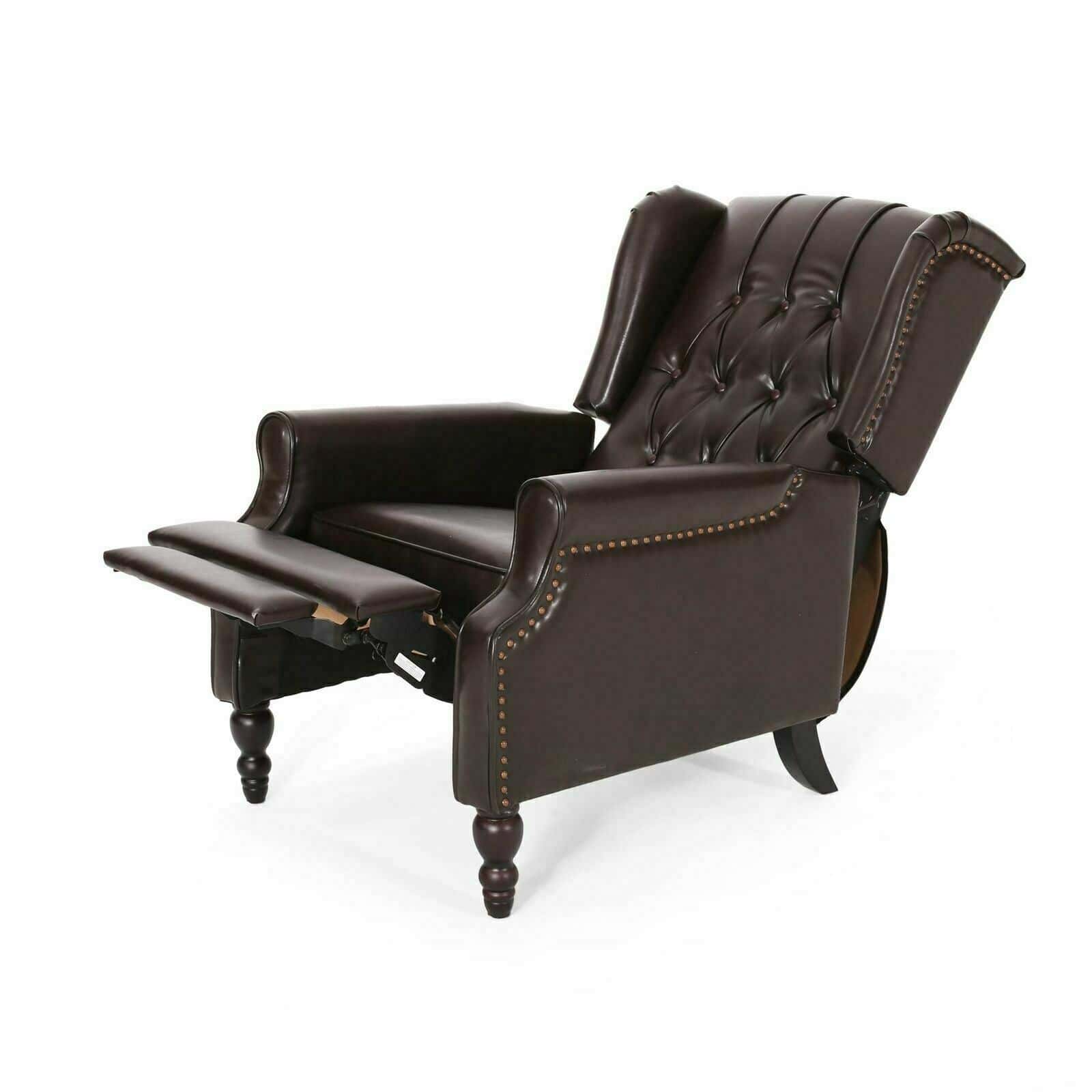 A brown leather recliner chair with nail head trim.