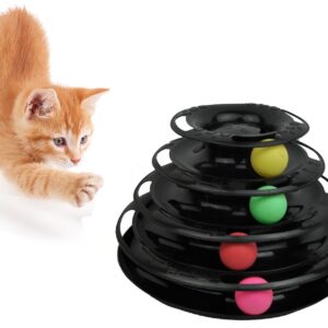A cat running towards a black object with colorful balls.