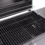 A grill with a lid open.