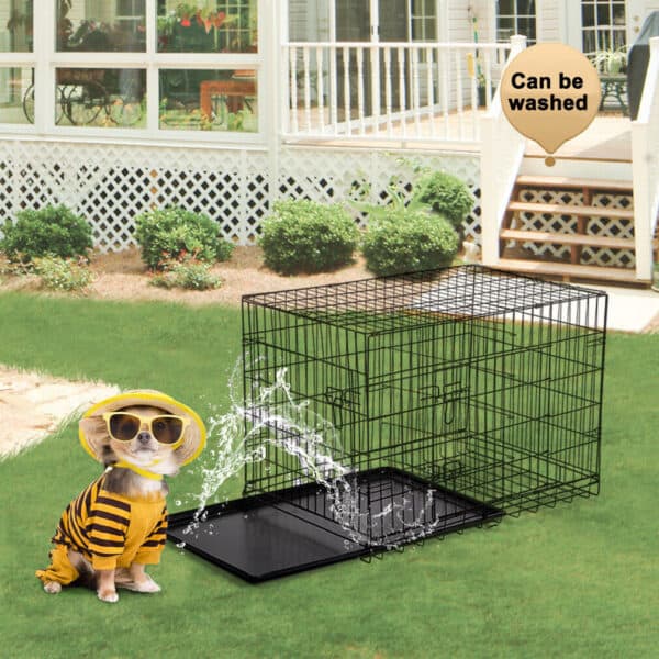 A dog wearing a bee costume in front of a dog crate.