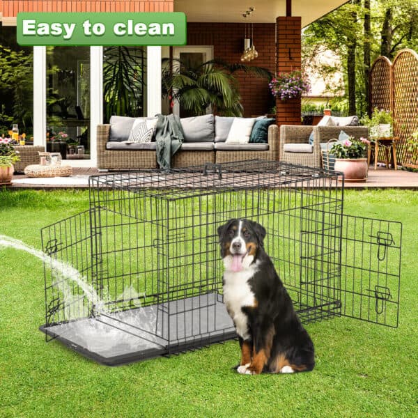 A dog is sitting in a dog crate in the grass.