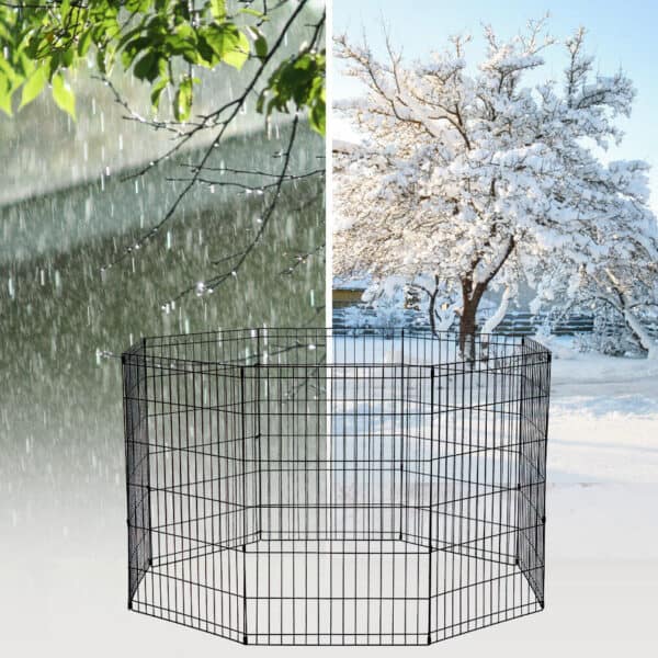 A picture of a snow covered dog kennel with a tree in the background.