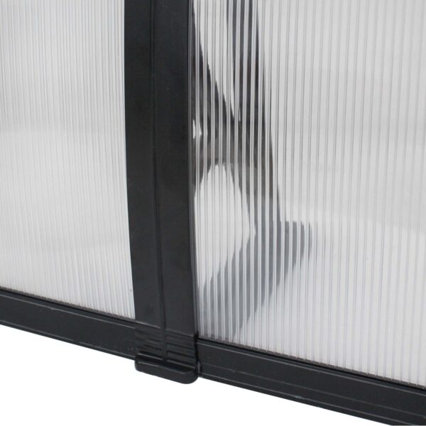 A close up of a black and white glass door.