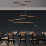 Modern dining room with a dark table, wooden chairs, and the 39"Wood Linear Pendant Light LED Dimmable Hanging Light Fixture Wood Linear Light Island Lights 24w Walnut, a remote control floating in the air, activating one light.