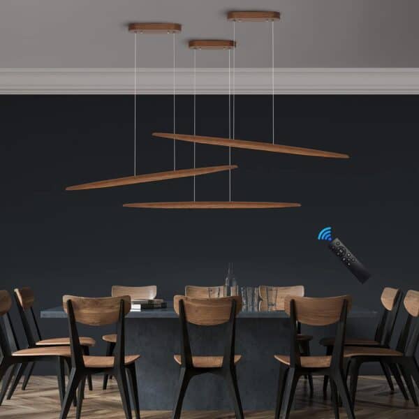 Modern dining room with a dark table, wooden chairs, and the 39"Wood Linear Pendant Light LED Dimmable Hanging Light Fixture Wood Linear Light Island Lights 24w Walnut, a remote control floating in the air, activating one light.