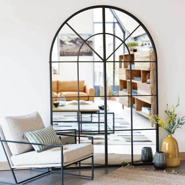 Large Arched Window Finished Metal Mirror 32x45" Wall Mirror Windowpane Decoration for Living Room reflecting a stylish living room with contemporary furniture and decor.