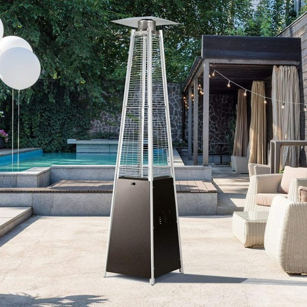A PAMAPIC Pyramid-style patio heater is positioned on a terrace by a pool, with outdoor furniture and greenery in the background.