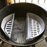 Slow 'N Sear Stainless Steel Charcoal Basket for 18" Charcoal Grills from SnS Grills with split metal inserts for indirect cooking.