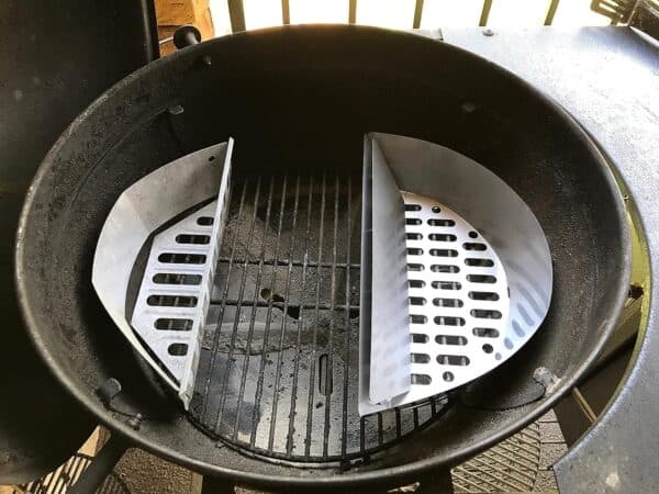 Slow 'N Sear Stainless Steel Charcoal Basket for 18" Charcoal Grills from SnS Grills with split metal inserts for indirect cooking.