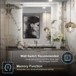 Elegant bathroom with a large 36 x 24 LED Bathroom Mirror featuring an image of a woman, marble walls, dual sinks, decorative flowers, and modern lighting.