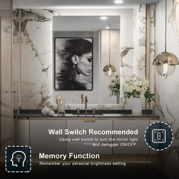 Elegant bathroom featuring a 36 x 28 Inch LED Backlit Mirror Bathroom Wall Mounted Vanity Mirror above a sink, decorated with flowers and display bottles, with icons explaining the mirror's memory function and wall switch recommendation.
