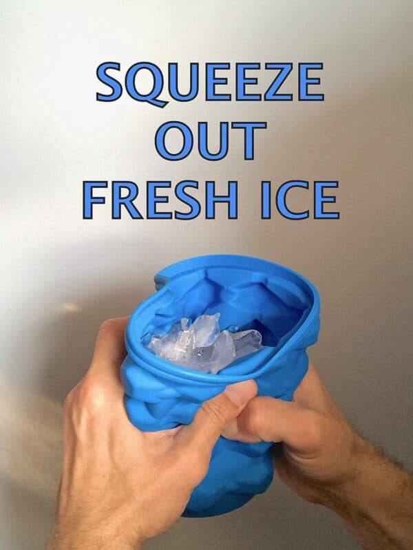 The Mini Ice Cube Maker Silicone Bucket Ice Mold and Storage Bin Blue: Hands squeezing a blue, flexible ice cube tray with the phrase "squeeze out fresh ice" at the top, releasing mini ice cubes.