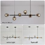 A Light Pendant Lighting Mid-Century Glass Globes Chandelier Black with multiple glass globes displayed in three settings: warm white, white light, and turned off.