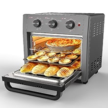 A WEESTA 5-In-1 Air Fryer Toaster Oven Convection Oven Countertop with multiple shelves cooking a pizza on top and pastries on the bottom.