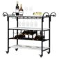 HODELY Three-Layer Wine Bottle Layer Marble Movable Iron Wine Cart with three shelves, featuring wine glasses, two wine bottles, some fruit, and plates, mounted on wheels.
